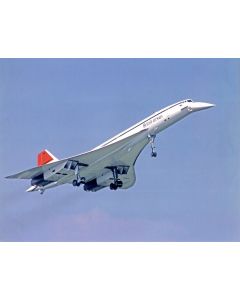 British Airways Concorde supersonic airplane in flight against a blue sky.
