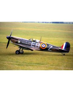 Supermarine Spitfire P7350 on a grassy field, featuring distinctive camouflage, roundel markings, and "EB-Z" designation.