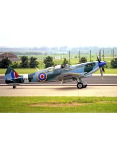 Historic Spitfire aircraft PT462 taking off from a runway, showcasing its distinctive camouflage and roundel markings against a lush green background.