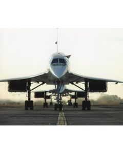 Supersonic aircraft on runway, showcasing a sleek, aerodynamic design with nose prominently angled upwards.
