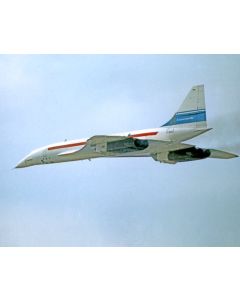 Concorde supersonic jet in flight against a cloudy sky, showcasing its distinctive delta wing design and iconic red and blue livery.