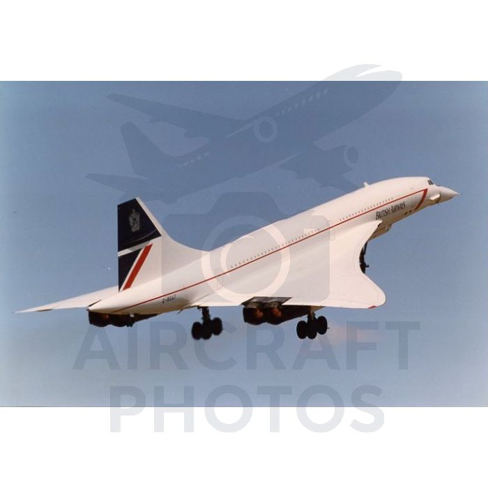 British Airways Concorde supersonic jet taking off against a clear blue sky.