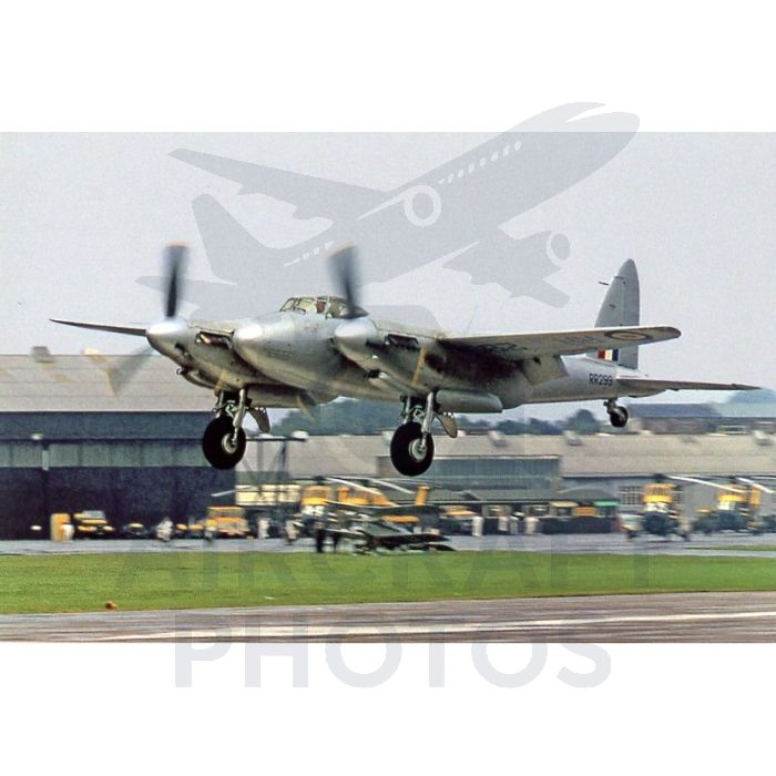 Vintage Silver Mosquito aircraft taking off from an airfield, showcasing its distinctive twin-engine design and propellers.