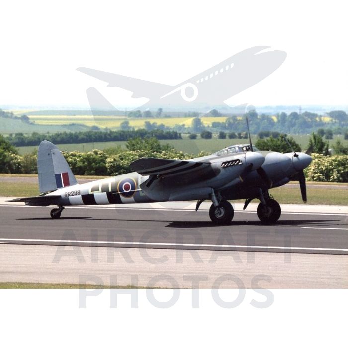 Classic British WWII aircraft taxiing on a runway, featuring distinctive black and white camouflage patterns and a recognizable tail design.
