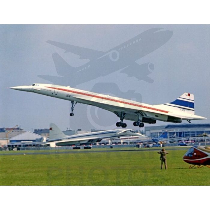 Concorde aircraft taking off at an airport with a clear blue sky in the background.