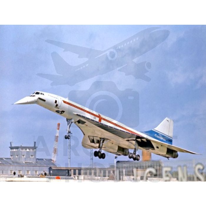 Concorde supersonic jet taking off against a cloudy sky, with a control tower in the background.