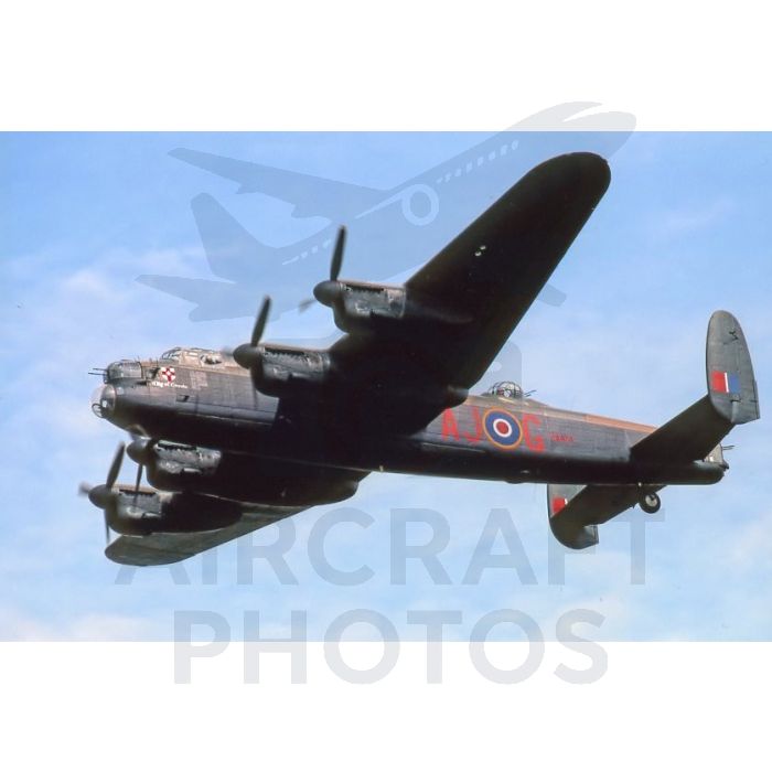 Avro Lancaster PA474 in flight displaying the City of Lincoln crest, photographed by Stuart H Bourne. Four-engine RAF bomber with camouflage livery and AJ-G fuselage code.