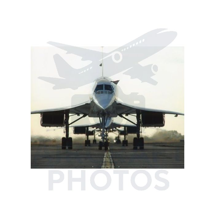Supersonic aircraft on runway, showcasing a sleek, aerodynamic design with nose prominently angled upwards.